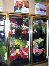 Refrigerated display coolers for cut flowers and delicate products